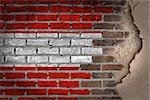 Dark brick wall texture with plaster - flag painted on wall - Austria