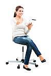 Female student sitting on a chair with a tablet with thumbs up, isolated over a white background