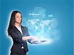 Beautiful businesswomen in suit using digital tablet. World map, transparent hexagons, graphs and network
