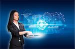 Beautiful businesswomen in suit using digital tablet. Glow circles, transparent rectangles, graphs and network