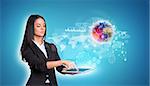 Beautiful businesswomen in suit using digital tablet. Earth with world map, graphs and network. Element of this image furnished by NASA