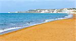 Xi Beach with orange sand and white cliffs. Morning view (Greece, Kefalonia). Ionian Sea.