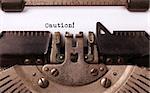 Vintage inscription made by old typewriter, caution