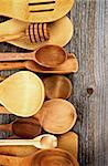 Frame of Various Wooden Spoons and Cooking Utensils isolated on Rustic Wooden background