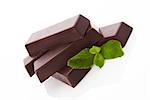 Delicious chocolate bar with fresh mint leaves isolated on white background. Delicious chocolate sweets.