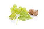 Wine cork and green grapes isolated on white background with reflection. Luxurious wine drinking still life. Minimal sparse style.