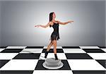 Beautiful dancer dancing. Floor with checkerboard texture and gray wall