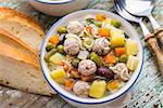 Delicious meatball soup with vegetables in a bowl