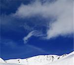 Winter mountains and blue sky. Caucasus Mountains, Georgia. Ski resort, Gudauri.