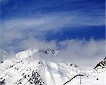 Winter mountains and sky in mist. Caucasus Mountains, Georgia. Ski resort, Gudauri.