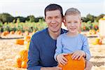 family of two at pumpkin patch