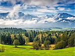 Landscape in Allgau Bavaria with mountains and meadows
