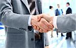 Close up of businessmen shaking hands