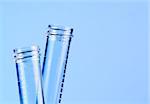 detail of the test tubes in laboratory on blue light tint background