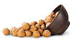 Walnuts Spill Out Of A Clay Bowl Isolated On White Background