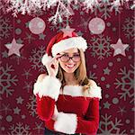 Sexy santa girl wearing spectacles against red vignette
