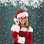 Sexy santa girl wearing spectacles against green vignette
