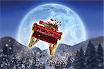 Santa flying his sleigh against christmas village under full moon