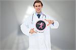 Doctor with breast cancer awareness message for awareness month