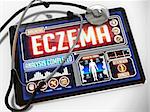 Eczema - Diagnosis on the Display of Medical Tablet and a Black Stethoscope on White Background.