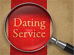 Dating Service through Magnifying Glass on Old Paper with Red Vertical Line.