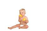 One year old boy with lemon on white background