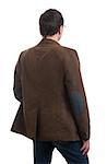 Back view of stylishly dressed man in a brown jacket