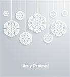 Christmas paper card with hanging snowflakes. Vector illustration.
