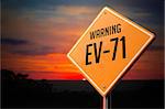 EV-71 on Warning Road Sign on Sunset Sky Background.