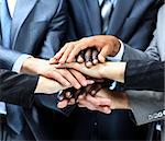 Closeup portrait of group of business people with hands together