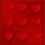 Various red heart shape icons with shadow over textured background
