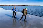 Two men ice-skating