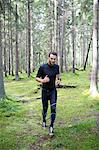 Man running in forest