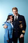 Pilot and stewardess together, studio shot