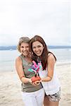 Two happy women on beach, Brazil