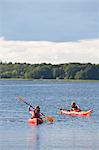 Teenage boys kayaking