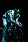 Man cycling, studio shot