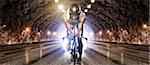 Man cycling through tunnel