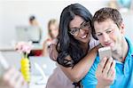 Young couple looking at cell phone