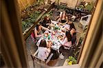 Teenage girls having meal on courtyard