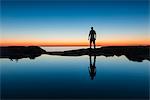 Silhouette of man at coast