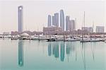 City skyline looking towards the Emirates Palace Hotel and Etihad Towers, Abu Dhabi, United Arab Emirates, Middle East