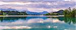 Lake Bled at sunrise with the Church on Lake Bled Island and Bled Castle, Gorenjska Region, Slovenia, Europe