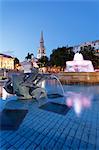 Fountain with statue of George IV and St. Martin-in-the-Fields church, Trafalgar Square, London, England, United Kingdom, Europe