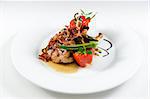 Grilled pork chop flamed in gin with sweet and sour vegetable ragout and honey-mustard sauce