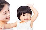Happy mother holding smiling child baby over white background