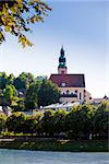 Hallstatt, Austria - August 5, 2013: Pfarramt Mulln catholic church, overseeing the historical old town in Salzburg, Austria.