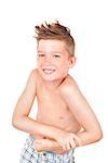Charming caucasian young boy without shirt showing muscle. Morning hygiene concept.