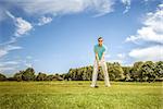 An image of a young male golf player at the green