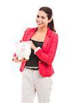 Business woman holding a piggy bank on the hands, isolated over a white background
